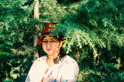 Portrait of woman standing on field