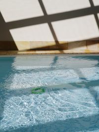 Close-up of swimming pool by sea against sky