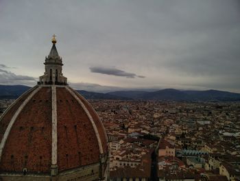 Cathedral in city against sky