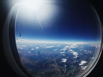 Aerial view of landscape seen through airplane window