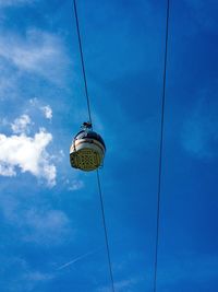 Low angle view of cables against blue sky