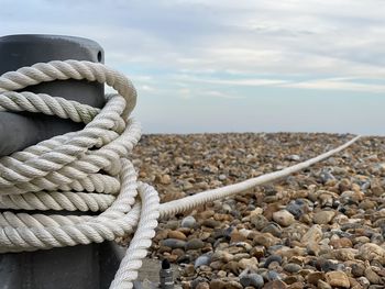 Nautical rope wrapped round steel pillar on the beach in eastbourne