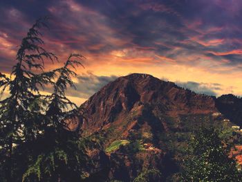 Scenic view of mountains against dramatic sky