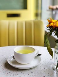 Close-up of coffee cup on table