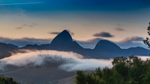 Scenic view of mountains against sky during sunset