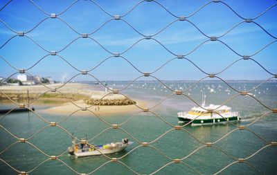 View of dock through chainlink fence