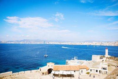 High angle view of sea against blue sky