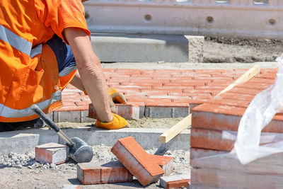 Midsection of man working in workshop