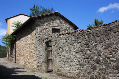 Low angle view of old building against sky