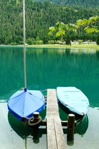 Boats moored in lake