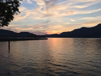 Scenic view of lake at sunset