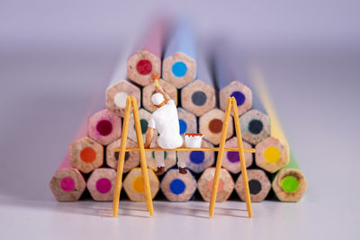 Close-up of multi colored pencils on table