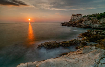 Scenic view of sea against sky during sunset