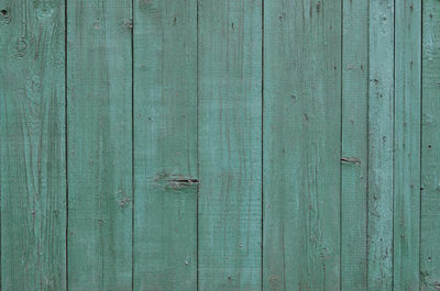 Full frame shot of green wooden fence