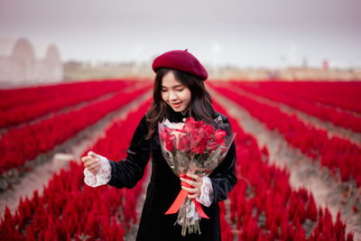 Young woman standing on field