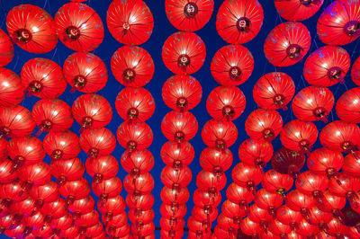Full frame shot of red lanterns hanging at night