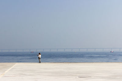 Silhouette of woman in sea