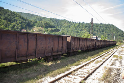 Train on railroad track against sky