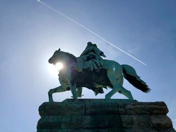 Low angle view of statue against sky