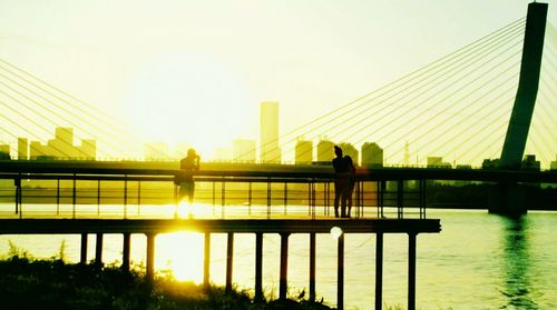 Silhouette of bridge at sunset