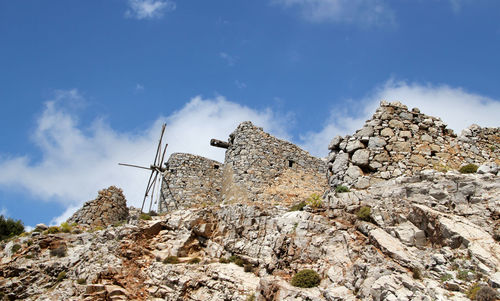 Ruins of ancient venetian windmills built in 15th century, lassithi plateau, crete, greece.