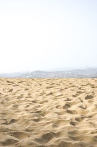 Scenic view of beach against clear sky