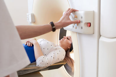 Doctor preparing patient for mri