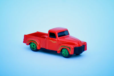 Toy car against blue background