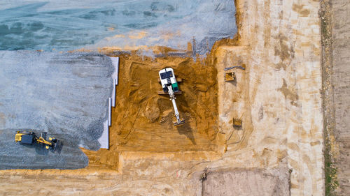 Directly above shot of construction vehicles at site