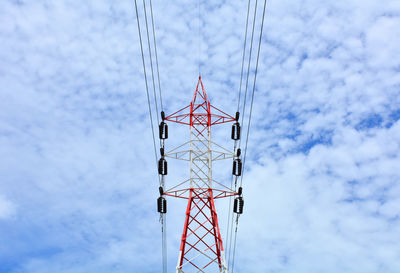 Low angle view of electricity pylon against sky