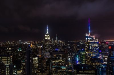 Illuminated city buildings at night