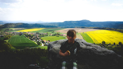 Woman on landscape against sky