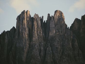 Low angle view of rock formations against sky in dolomites