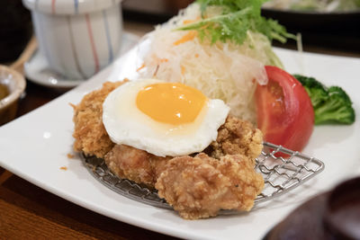 Close-up of breakfast served in plate on table