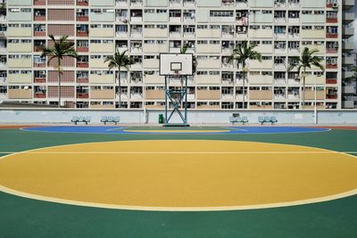 View of basketball court against building