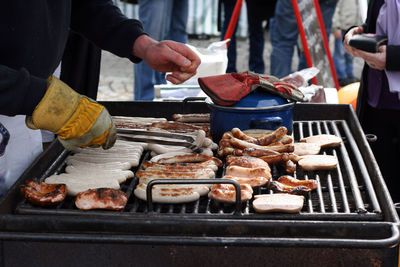 Man preparing food on barbecue grill