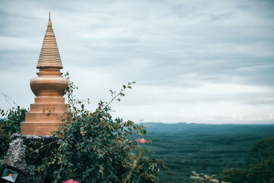 Panoramic view of temple and building against sky