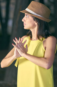 Young woman with yellow hat