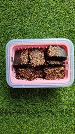 High angle view of food in container on field
