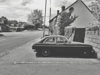 Cars on road against sky