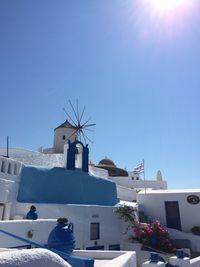 Low angle view of traditional windmill against clear sky