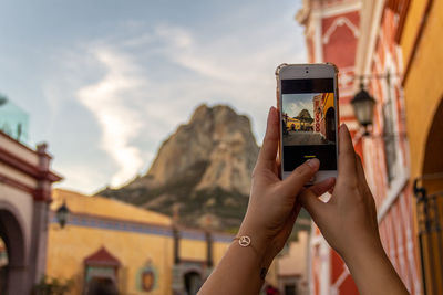 Man photographing with mobile phone