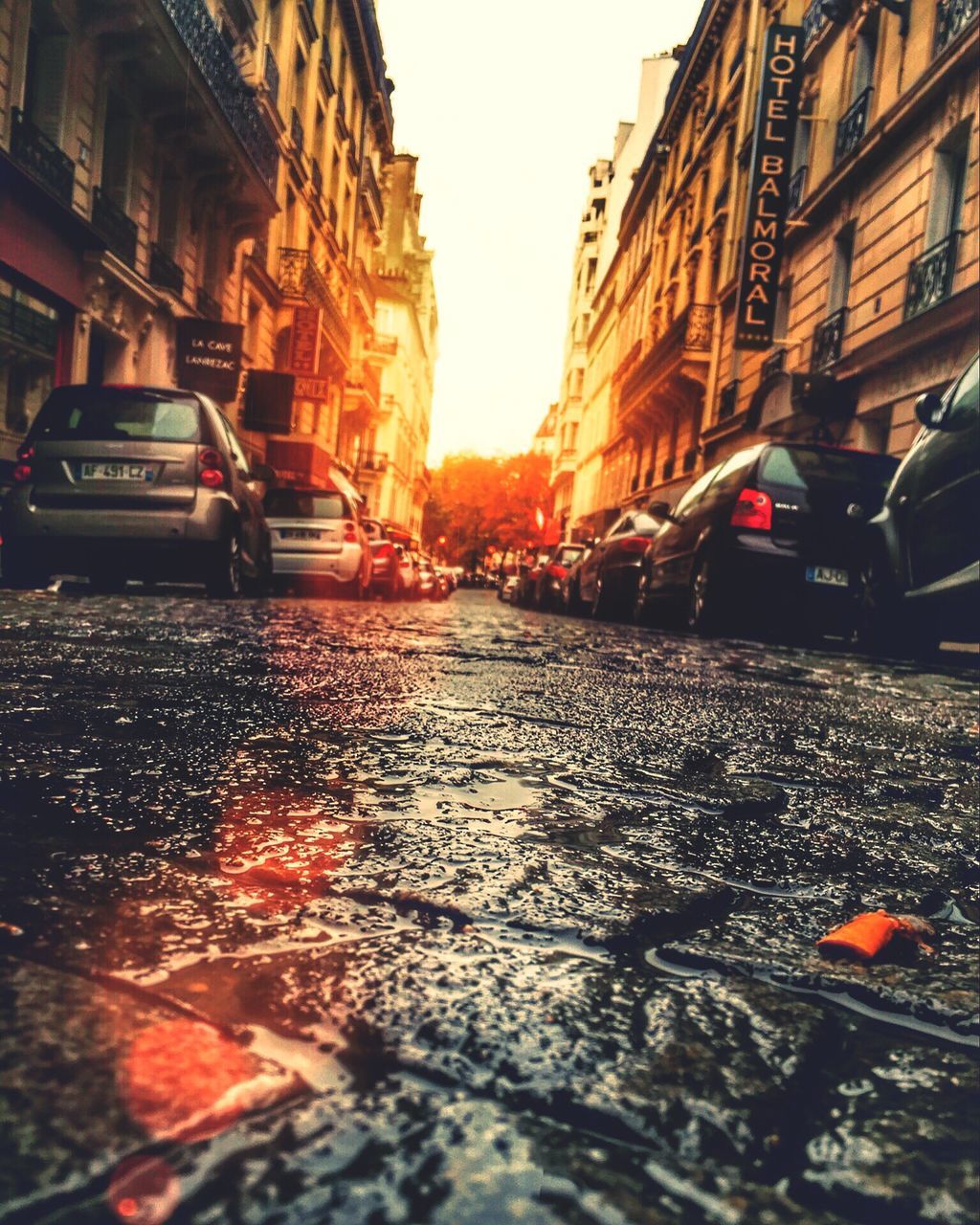 car, land vehicle, transportation, mode of transport, wet, city, yellow taxi, street, rain, traffic, road, water, no people, outdoors, day