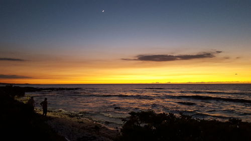 Scenic view of sea at sunset