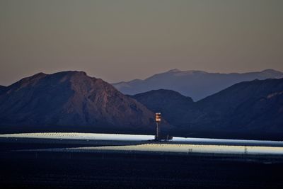 Scenic view of mountains against sky at night