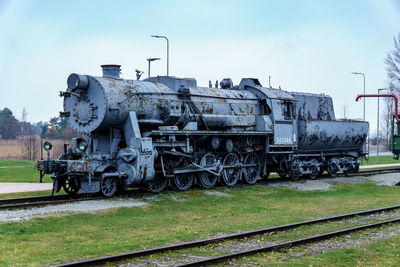 Train on railroad track against sky