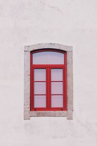 Window on white wall of building