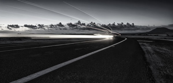 View of country road against sky