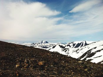 Scenic view of snow covered mountain against sky