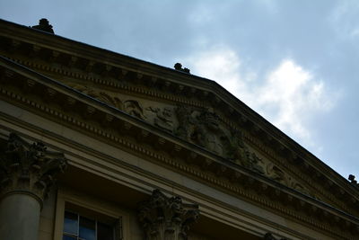 Low angle view of historical building against cloudy sky